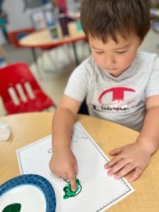 A child working on their letter.